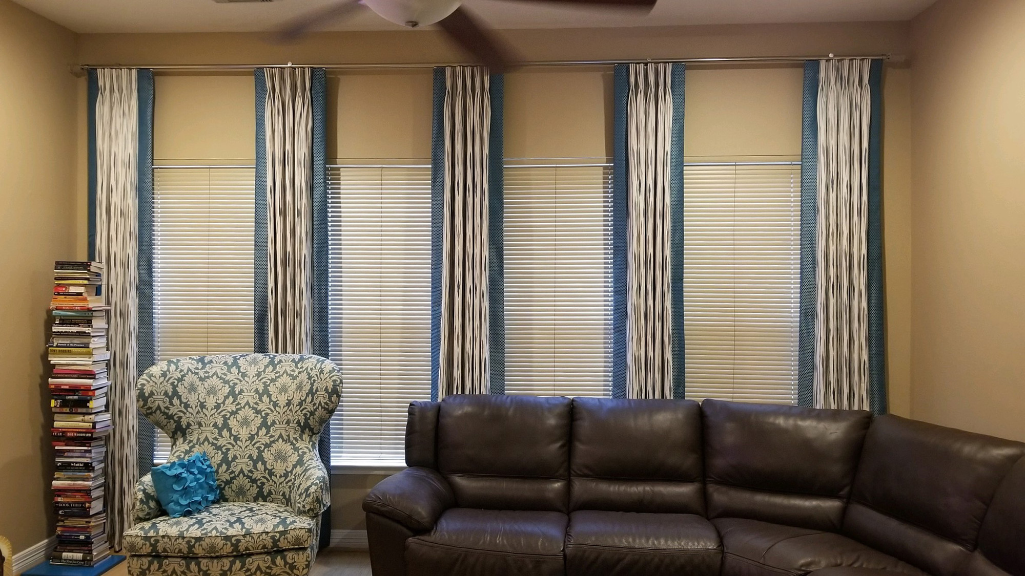 Pinch pleated panels with accent banding mounted on track rod_2000x1125